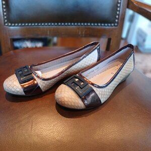 Low leather flats in a camel color.